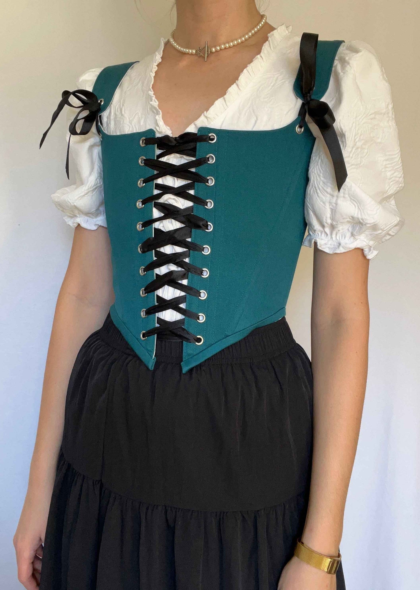 Teal corset with front and back ties, removable shoulder straps,